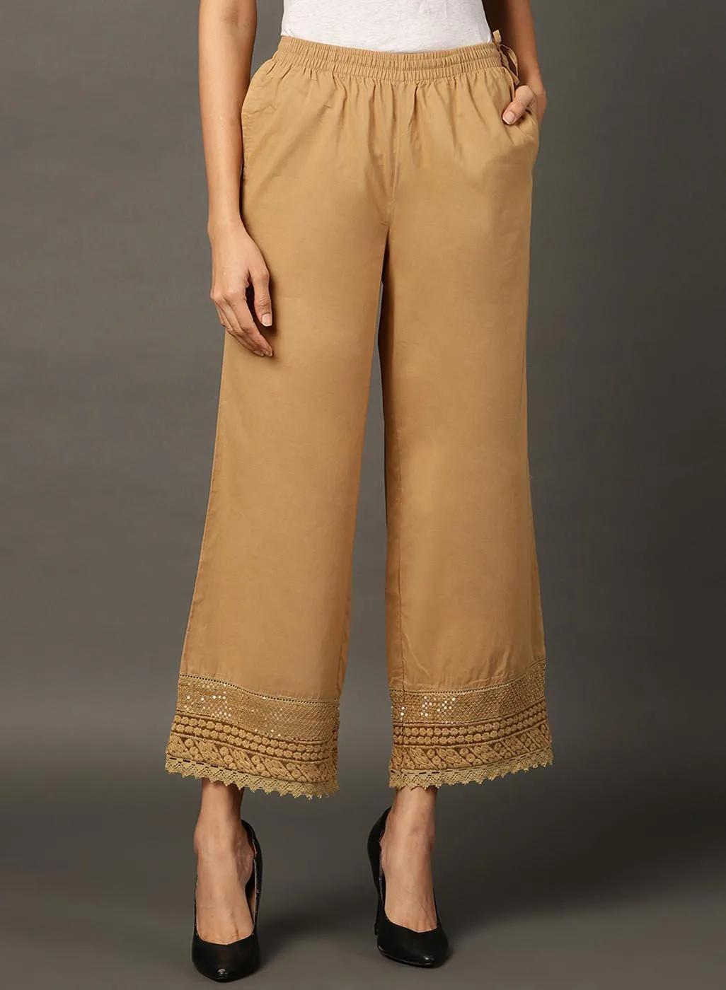 Beige Palazzos With Shimmery Details At The Hems